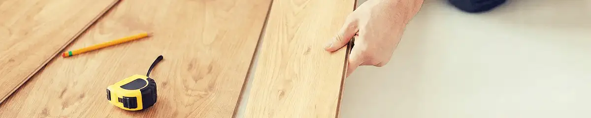 A professional installing wood flooring in Cincinnati, OH