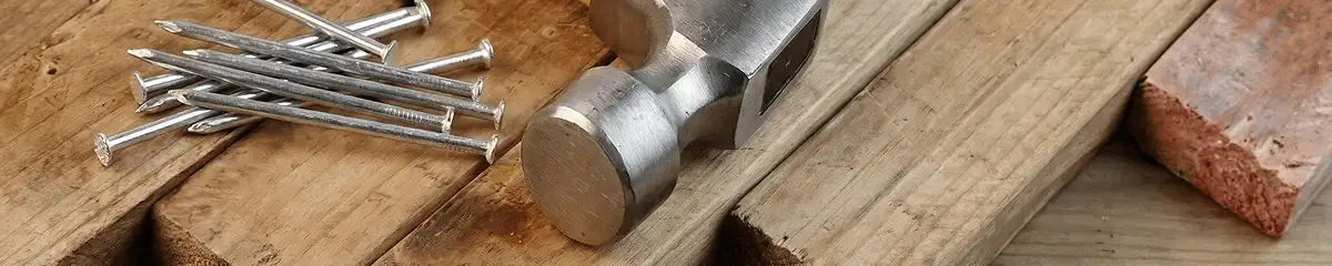 Hammer and nails on hardwood flooring boards in Cincinnati, OH