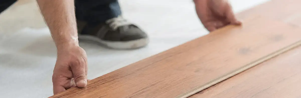 A professional installing laminate flooring in Cincinnati, OH
