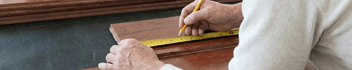 A professional installing wood flooring in Cincinnati, OH